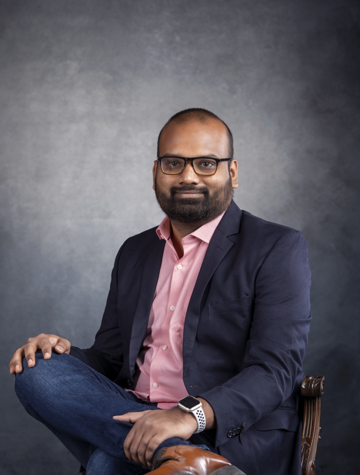 Sundar — founder of martech.llc, at the studio desk